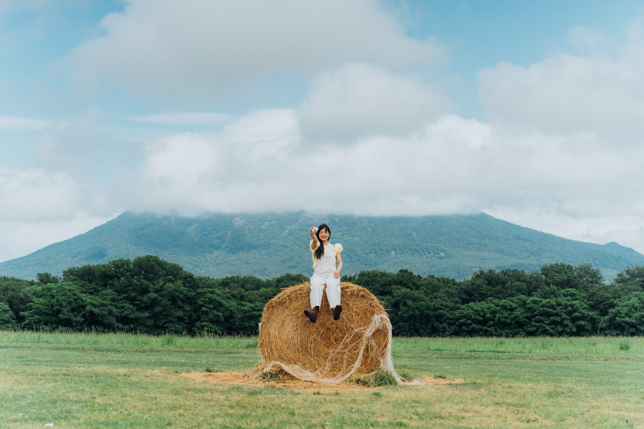 A Rest Atop the Hay Bale with Mount Yotei