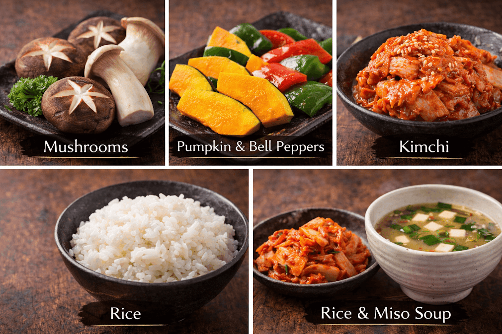 ปิ้งย่างญี่ปุ่น yakiniku คืออะไร – ภาพรวมเครื่องเคียงและวัตถุดิบยอดนิยมในร้านยากินิกุ เช่น เห็ดชิตาเกะ เห็ดออรินจิ ฟักทอง พริกหวาน กิมจิ ข้าวญี่ปุ่น และซุปมิโสะ จัดเสิร์ฟบนภาชนะสไตล์ญี่ปุ่น เหมาะสำหรับทานคู่เนื้อย่าง
