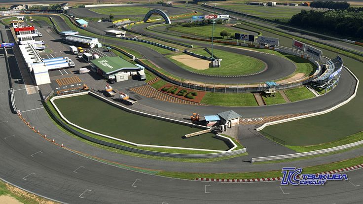สนามแข่งรถ Tsukuba Circuit ในประเทศญี่ปุ่น มุมมองทางอากาศของแทร็กโค้งต่อเนื่อง มีอาคารพิทและพื้นที่เซอร์วิสด้านข้าง เหมาะกับคำค้นหา “สนามแข่งรถญี่ปุ่น มีที่ไหนบ้าง”